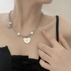 Faux pearl heart pendant necklace